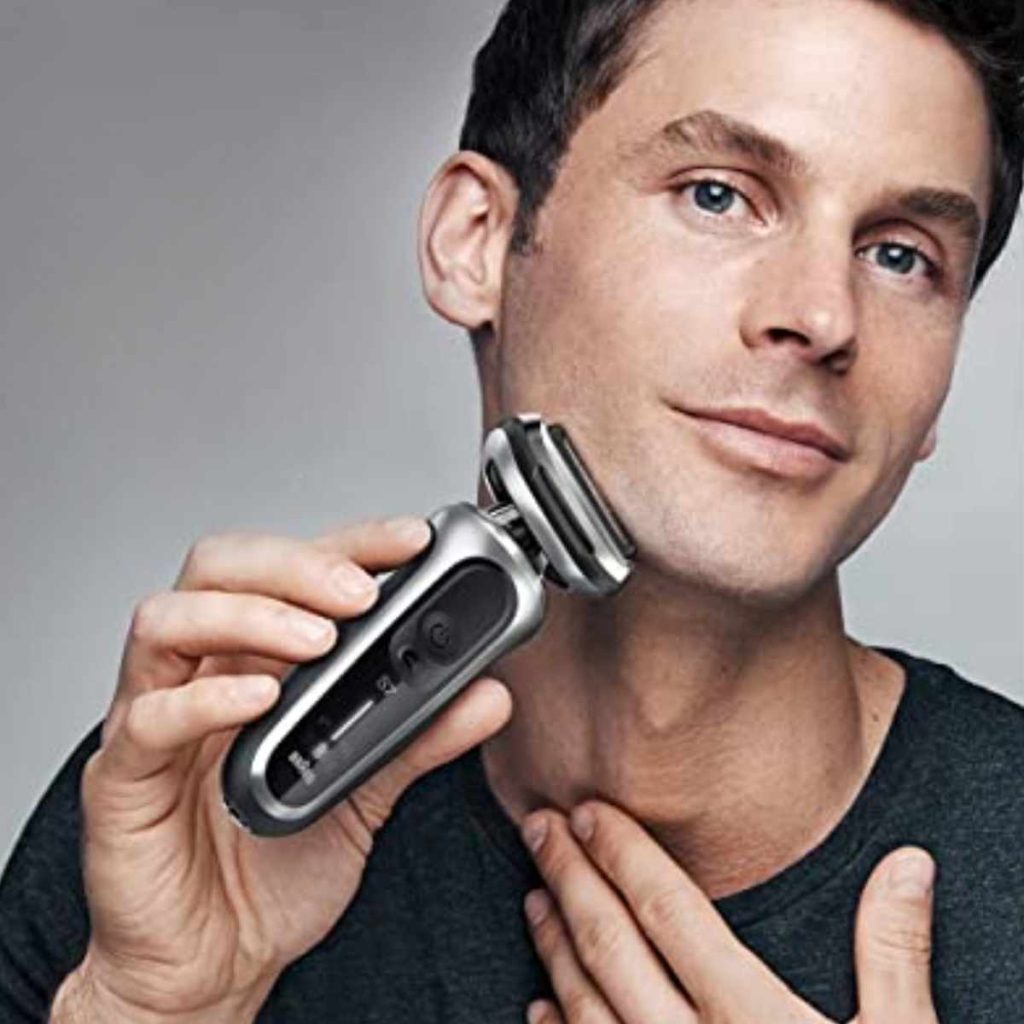 An image of a man shaving using a foil shaver